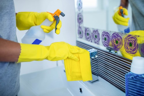 Deep cleaning kitchen and bathroom areas during a move out clean